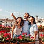 Friends on a rooftop terrace in Madrid, wearing ES glasses, smiling and looking up at the sky, enjoying the moment. August 12, 2026.