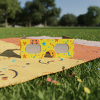 Vibrant solar eclipse glasses resting on a colorful picnic blanket in a sunny park setting. Perfect for safe viewing on August 12, 2026.
