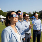 Colleagues at a community event, wearing Nebula design glasses while looking up, CE certified for safety.